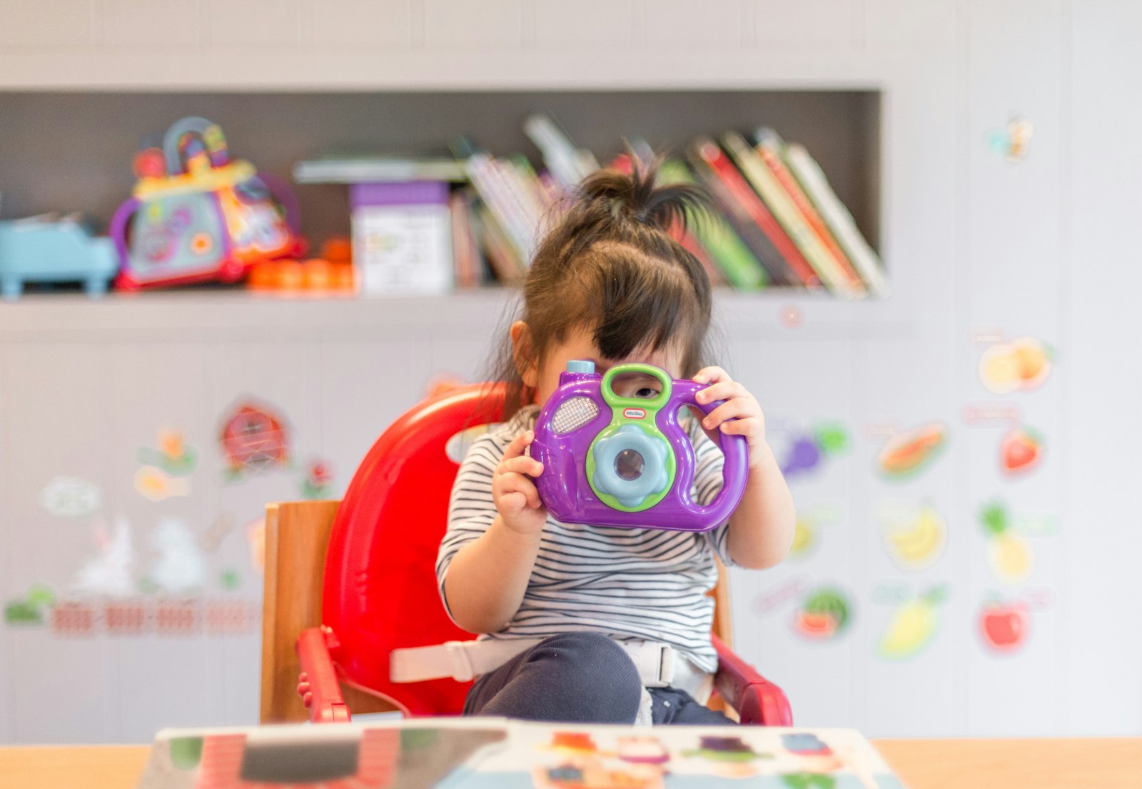 Child playing with wooden toys